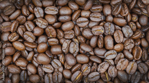Brown roasted coffee beans texture background for food and drink or agriculture concept design