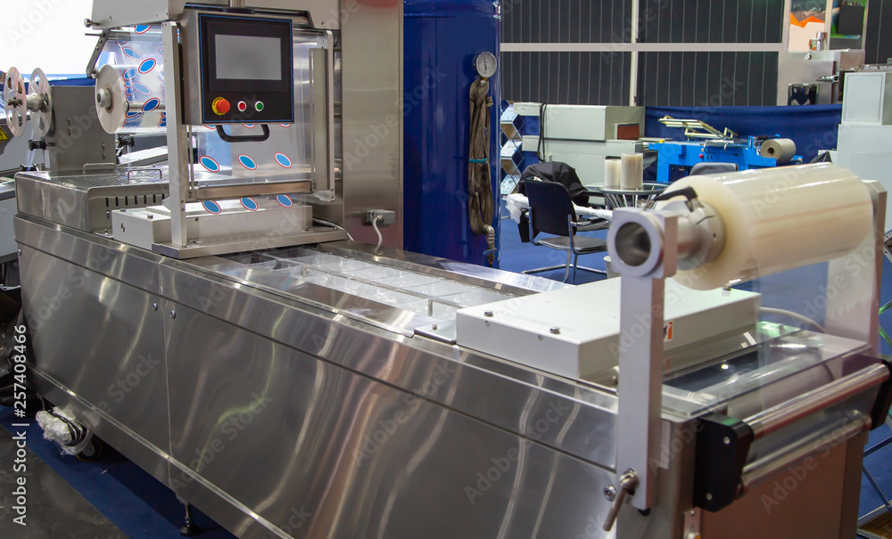 Linear tray food package heat sealing and machine. Food industry Linear tray food package heat sealing and machine. Food industry