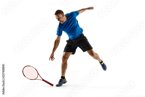 Stressed tennis player throwing and breaking a racket in anger and rage at court. Human emotions, defeat, crash, failure, loss concept. Athlete isolated on white © master1305