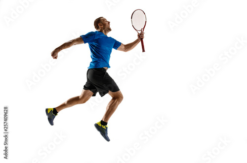 Portrait of a handsome male tennis player celebrating his success isolated on a white studio background. Human emotions, winner, sport, victory concept