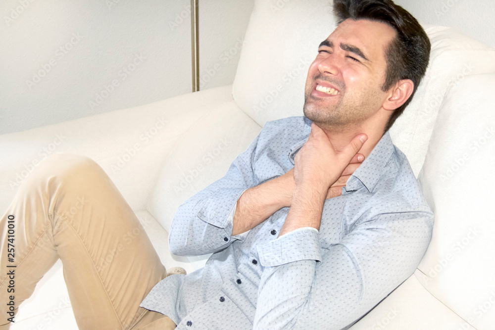 boy with a sore throat, with his hands on his throat. boy with a sore throat, with his hands on his throat.