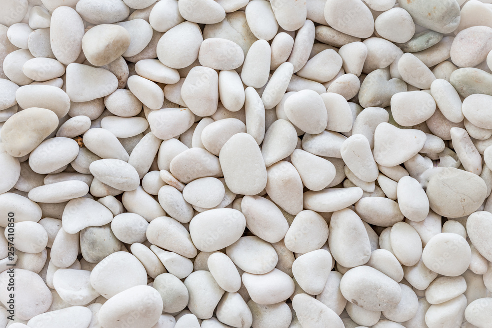 White pebbles stone texture and background. White pebbles stone texture and background.