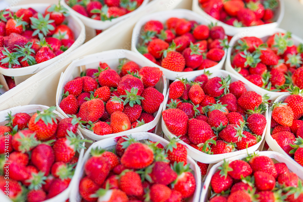 Fresh strawberry in cardboard boxes on the market Fresh strawberry in cardboard boxes on the market