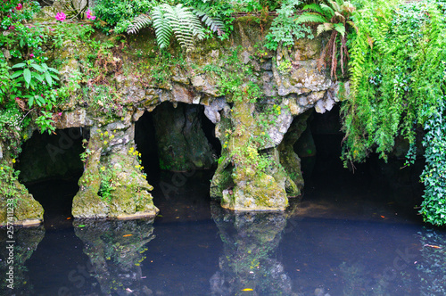 Fototapeta Naklejka Na Ścianę i Meble -  Pond and grotto in Quinta da Regaleira Park, Sintra, Portugal
