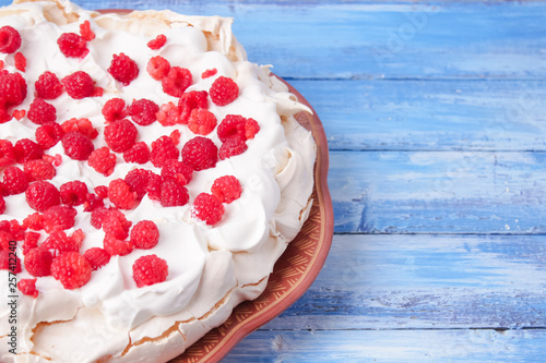 pavlova cake with raspberries and whipped cream