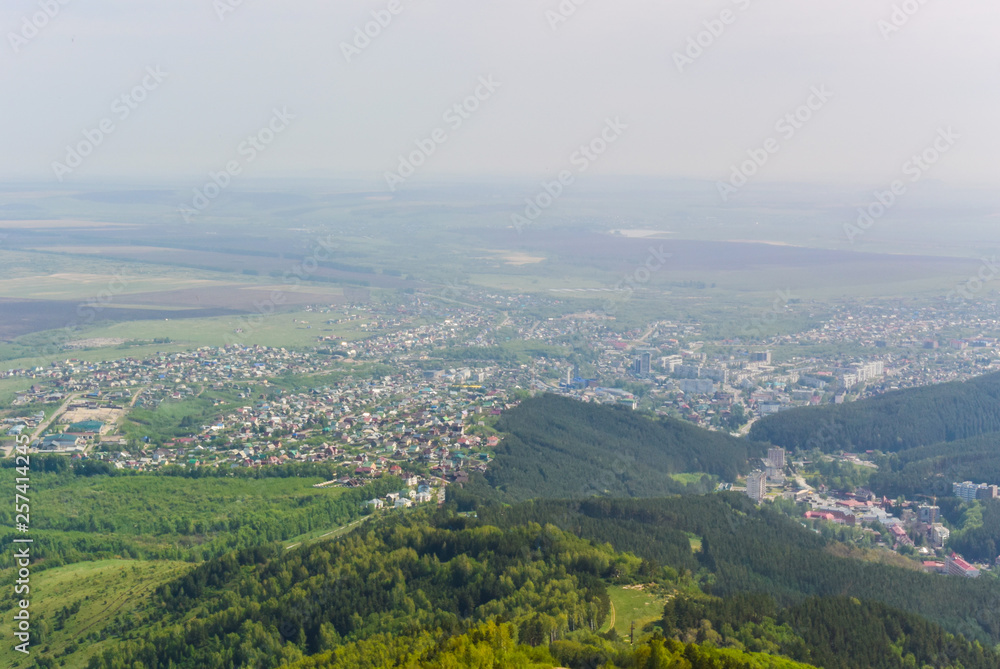 Fototapeta premium Panoramic view of the city from above and mountains