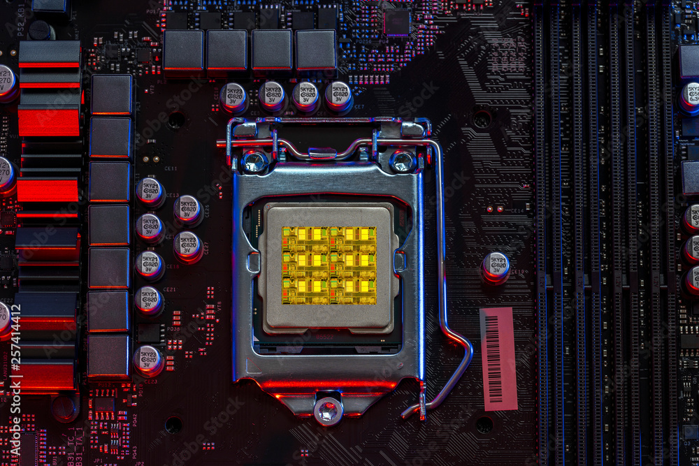 desktop six core processor 9th gen on background motherboard closeup top view, Red and Blue color light