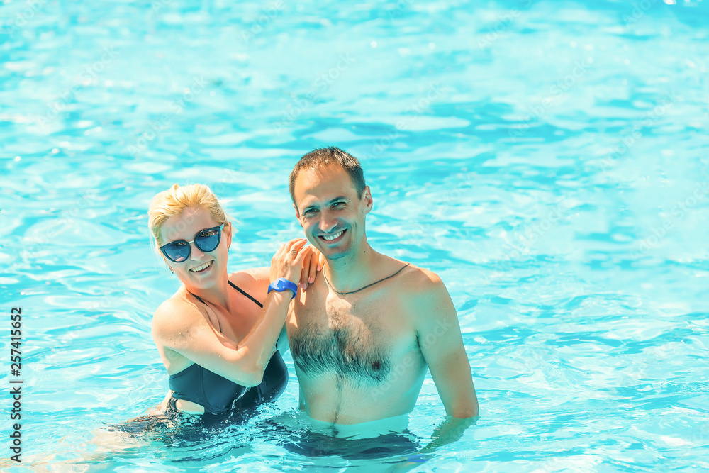 Affectionate couple in swimming pool