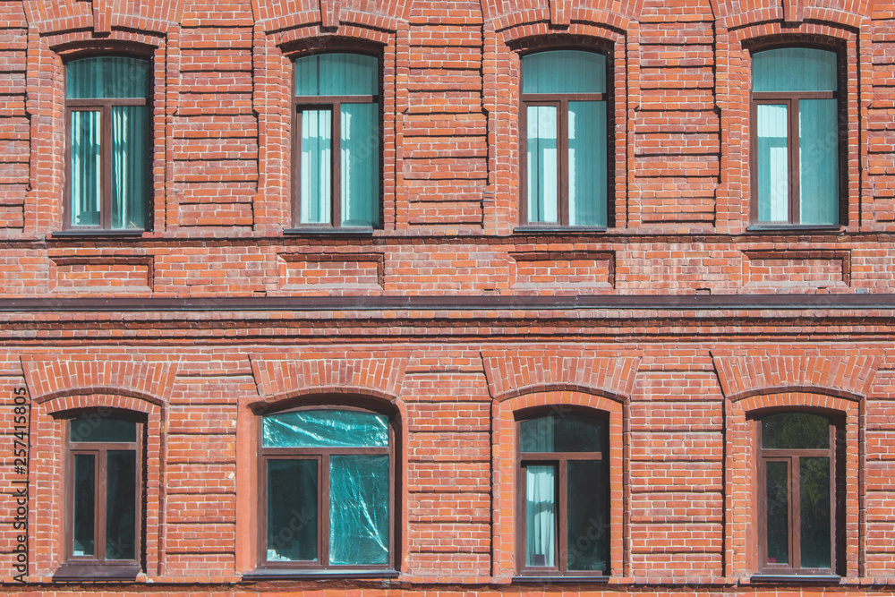 Texture of the wall of an old house with open and closed windows