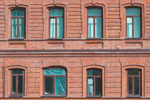 Texture of the wall of an old house with open and closed windows