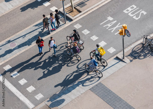 Fototapeta People crossing street Cycling and Walking Traffic sign Smart city Urban lifesty