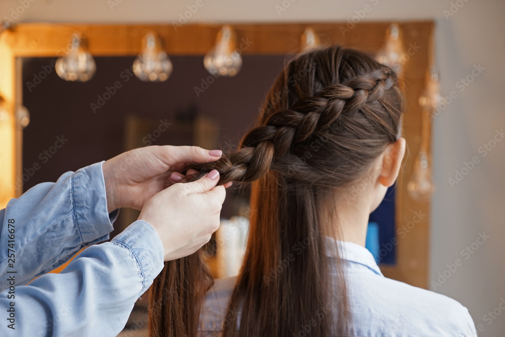 Hairdresser working with client in beauty salon Hairdresser working with client in beauty salon