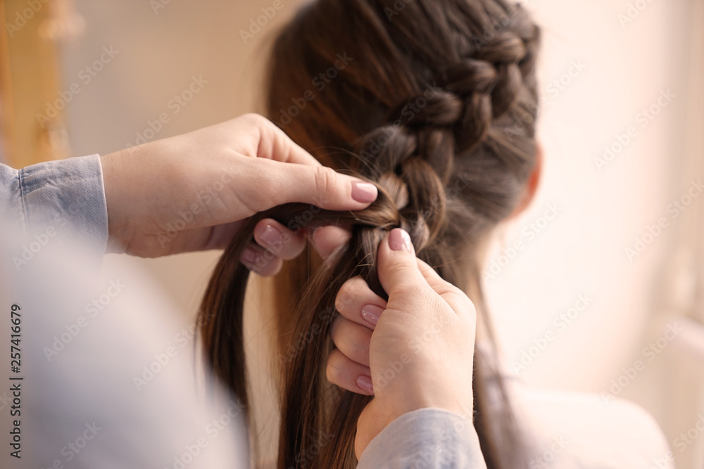 Hairdresser working with client in beauty salon Hairdresser working with client in beauty salon