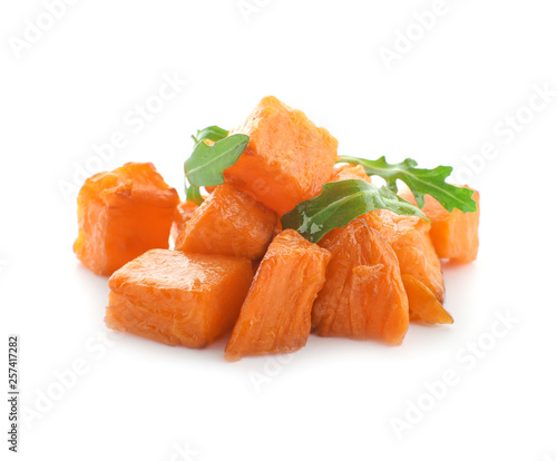 Pieces of tasty sweet potato with arugula on white background