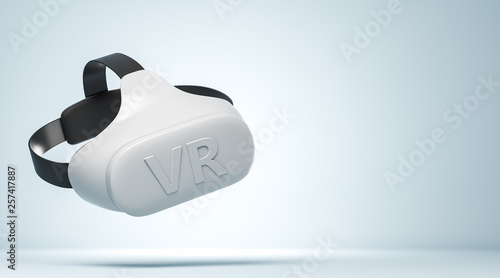 White VR headset with logo text on the light blue background with copy space on the right side.