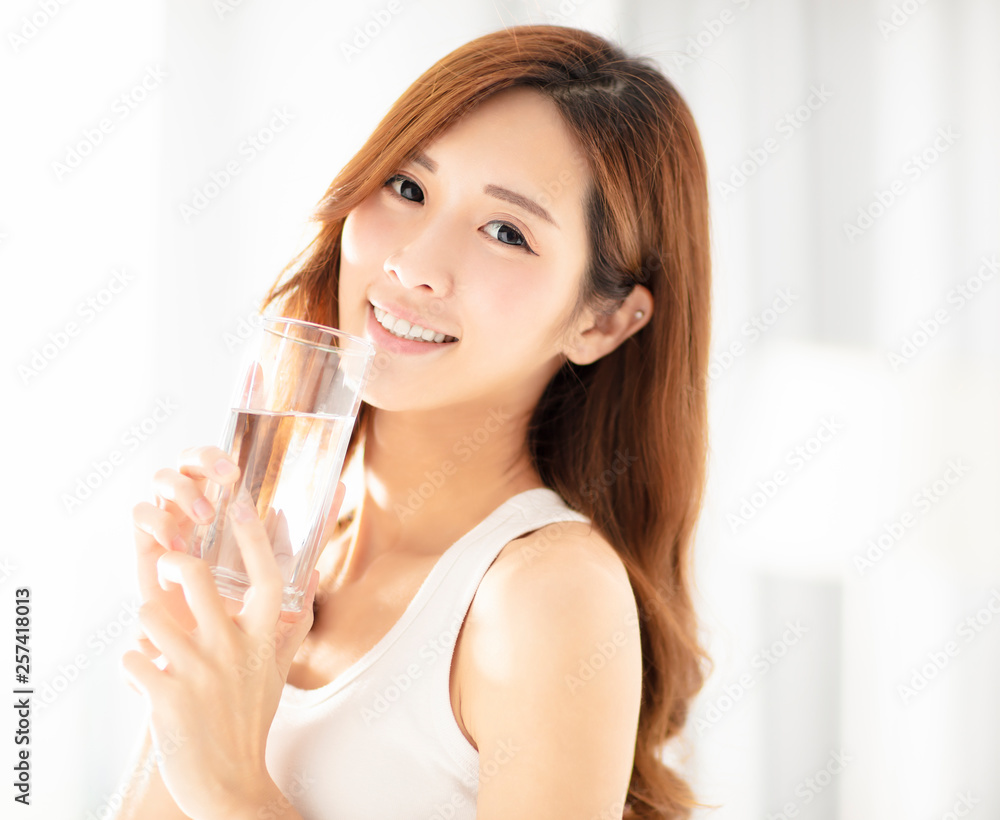 smiling beautiful young woman drinking water smiling beautiful young woman drinking water