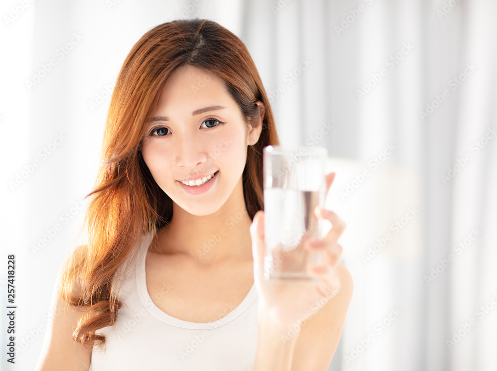 smiling beautiful young woman drinking water smiling beautiful young woman drinking water