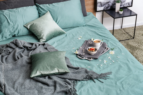 Tasty healthy breakfast on bed