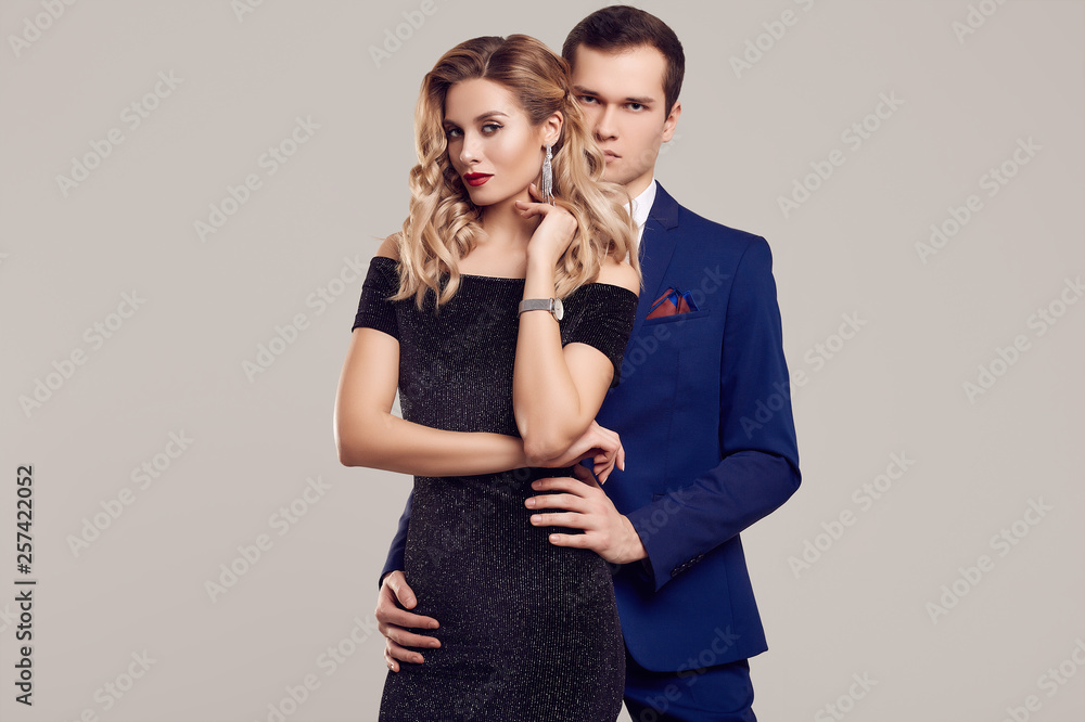 Sensual beautiful young couple dressed in formal clothes