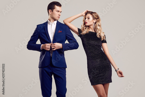 Sensual beautiful young couple dressed in formal clothes