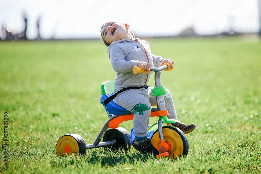 Cute little boy playing in the toy car Cute little boy playing in the toy car