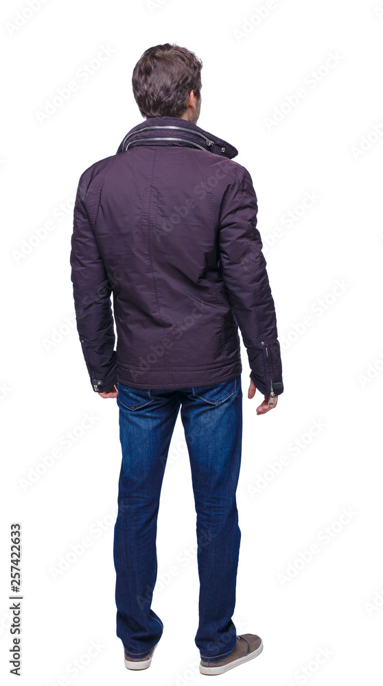 Back view of handsome man In long black jacket. Back view of handsome man In long black jacket.