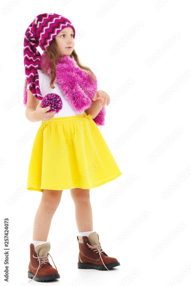 Little girl in a hat and scarf. Little girl in a hat and scarf.