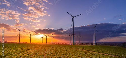 Sunset with wind turbines photo