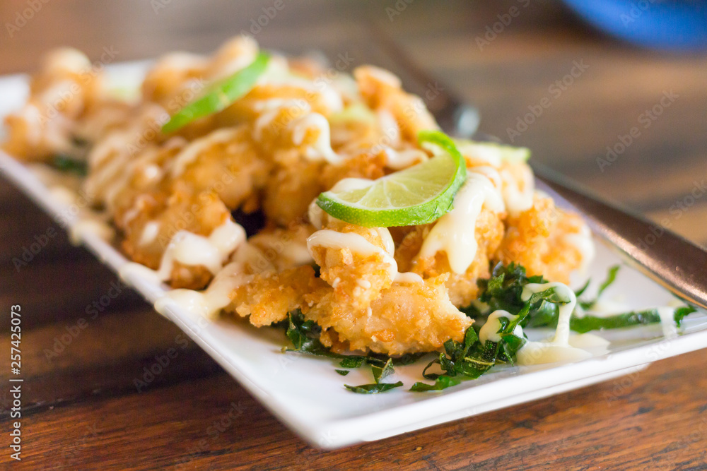 fried chicken with sour sweet sauce and fresh salad fried chicken with sour sweet sauce and fresh salad