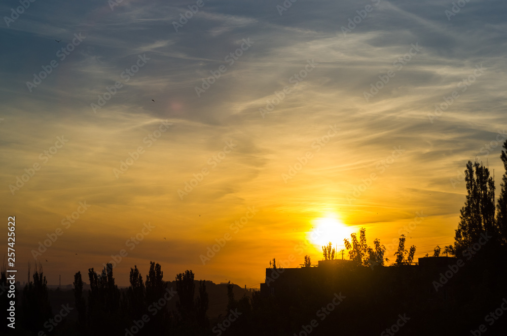 Landscape with dramatic light - beautiful golden sunset with saturated sky and clouds. Landscape with dramatic light - beautiful golden sunset with saturated sky and clouds.
