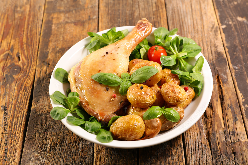 Fototapeta premium grilled duck leg with lettuce and potato