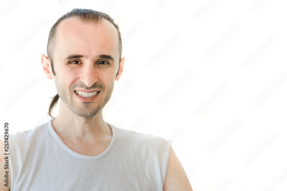 Happy brunet man with white shirt smiling on white background Happy brunet man with white shirt smiling on white background