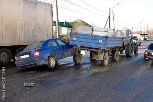 passenger car collided with a cargo trailer on the road