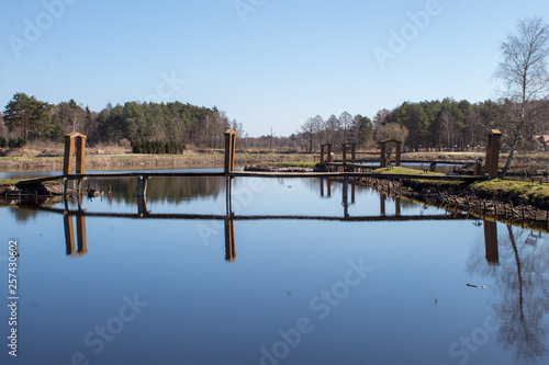 A beautiful place on the lake in a pine forest, a recreation center and slave fishing on the lake, a recreational place in Poland, Europe © Olena