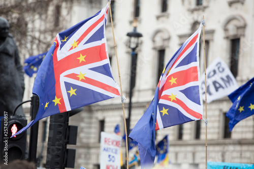 European Union and British flags fly together at an anti-Brexit political march