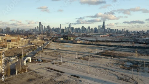 4k Aerial perspective of the undeveloped Lincoln Yards area in Lincoln Park, Chicago with Chicago skyline in background photo