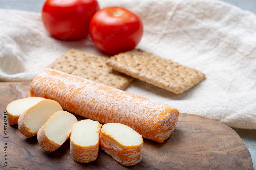 Fagotin cheese with  orange coloured rind made from cow milk in caves of Maredsous abbey, Belgium