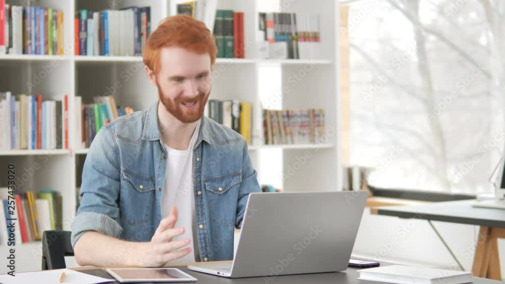 Online Video Chat on Laptop by Casual Redhead Man Online Video Chat on Laptop by Casual Redhead Man