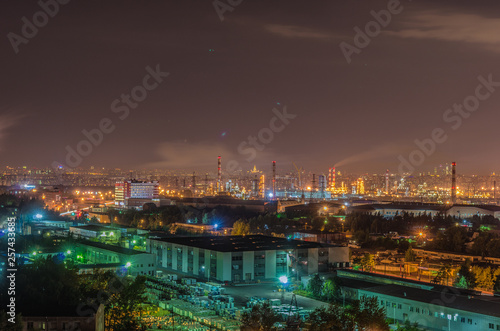 Night view of an industrial city with plants and lights