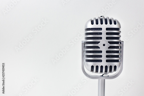 The vintage microphone close up image on white background..