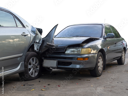 Car crash accident on street with wreck and damaged automobiles. Accident caused by negligence And lack of ability to drive. Due to illness © Prot