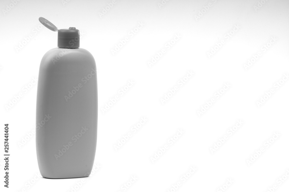 Baby oil or shampoo bottle isolated on white background. Copy Space and Black and White Baby oil or shampoo bottle isolated on white background. Copy Space and Black and White