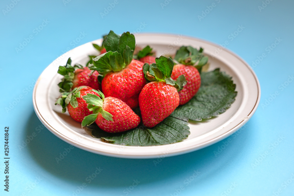 Juicy fresh strawberries on a plate Juicy fresh strawberries on a plate