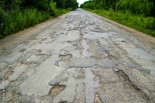 Bad road cracked and damaged