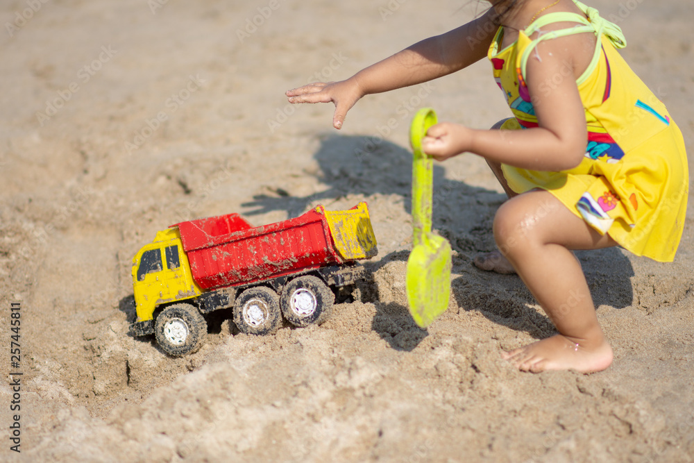 Children playing on sand beach with sunny day. soft focus. Children playing on sand beach with sunny day. soft focus.