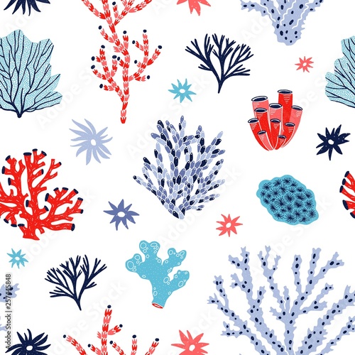 Seamless pattern with red and blue corals and seaweed or algae on white backg...