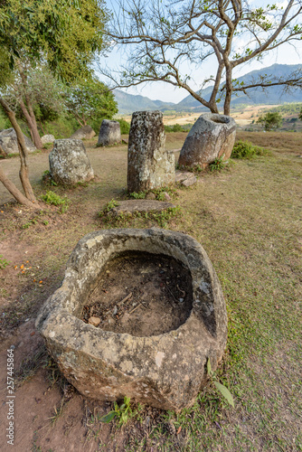 The Plain of Jars site 3 sits on a scenic hillside in pretty woodland near the village of Ban Lat Khai, Phonsavan, Xieng Khouang Province. photo