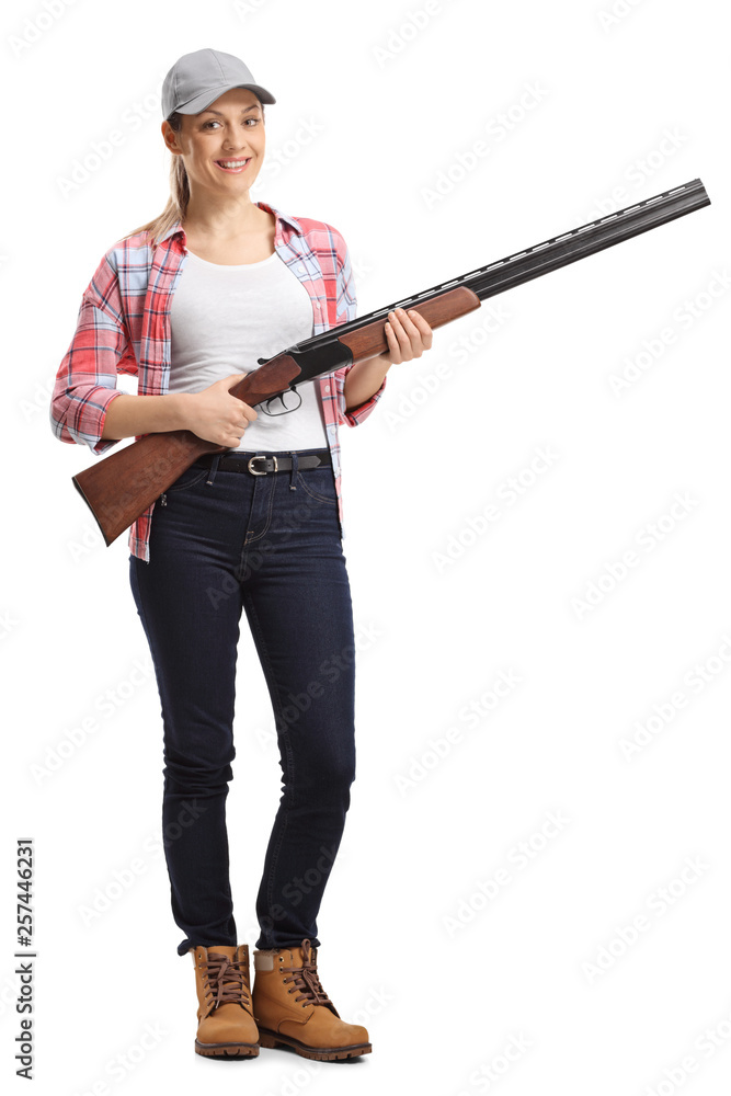 Young woman with a shotgun Young woman with a shotgun