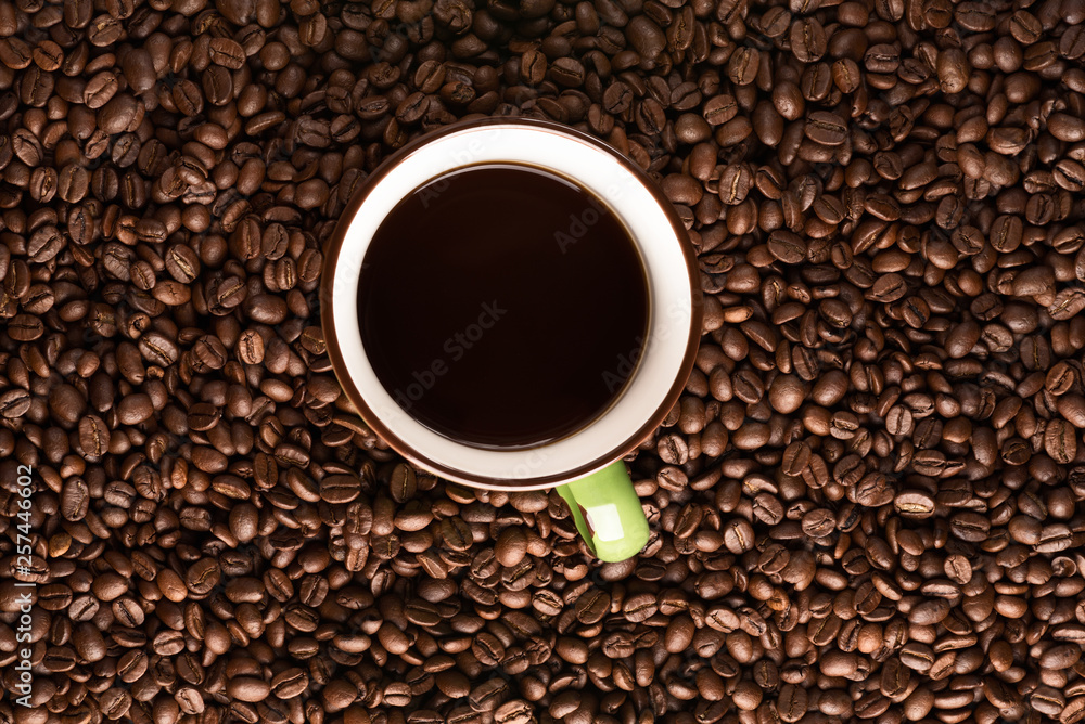coffee mug with coffee on coffee bean texture coffee mug with coffee on coffee bean texture