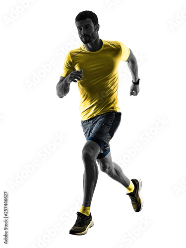 one caucasian man runner running jogging jogger silhouette isolated on white background © snaptitude